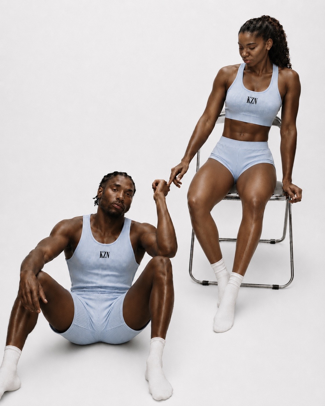 Two athletes wearing pale blue KZN training kit
